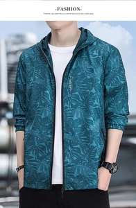 Detail of men's hooded sun protection jacket with leaf pattern and zip pocket