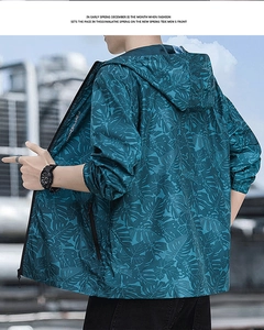 Detail of men's lightweight sun protection jacket with green tropical leaf pattern