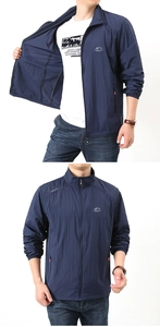 Detail view of men's dark blue outdoor sun protection jacket with stand collar and zipper