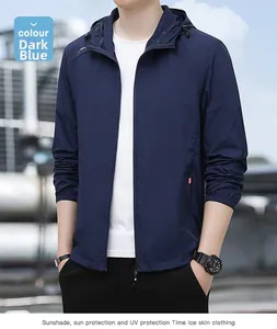 Detail of dark blue lightweight sun protection jacket with hood and red zipper accent