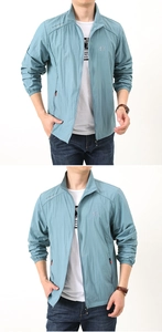 Detail of lake blue stand collar sun protection jacket with zip pockets and elastic cuffs