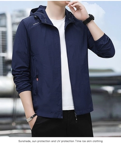 Detail of dark blue lightweight sun protection jacket with hood and zippered pockets