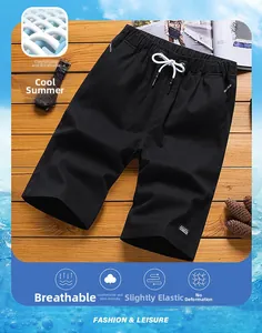 Detail of breathable black sports shorts with elastic drawstring waist and side pocket