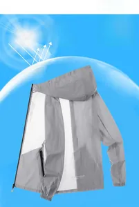 Detail of grey sun protection jacket showing hood, black zipper, and elastic cuffs