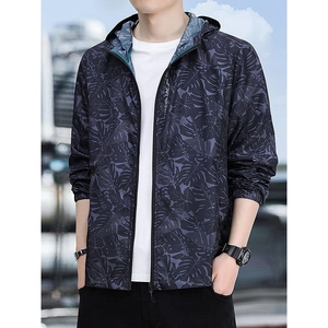 Men's lightweight hooded sun protection jacket with dark tropical leaf print and full zipper