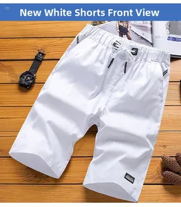 Detailed view of white cotton shorts featuring elastic drawstring waist and woven labels