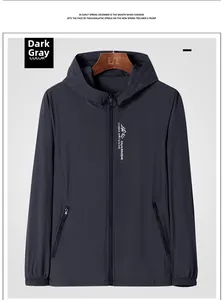 Detail of dark grey hooded sun protection jacket with zip pockets and chest logo