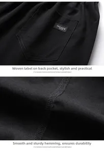 Detail of the reinforced stitching and decorative woven label on the black cotton shorts