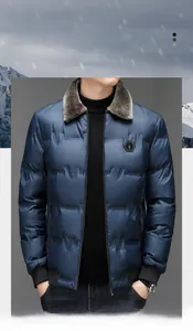 Macro shot of navy blue quilted winter coat with fur collar and tactical chest patch