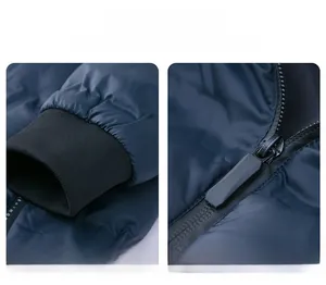 Detailed close-up of dark blue padded jacket featuring ribbed cuffs and branded zipper pull