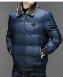 Detail of winter navy jacket featuring a thick brown faux fur collar and quilted texture