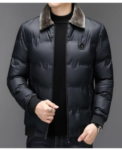 Detail of men winter jacket featuring a plush faux fur collar and textured black fabric