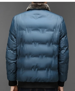 Back view of heavy winter puffer jacket with large fur collar and navy quilted fabric
