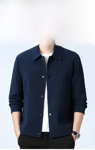 Detail shot of navy blue men's casual jacket with waffle texture and metal buttons