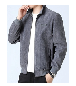Close-up of grey corduroy jacket featuring stand collar and ribbed hem details