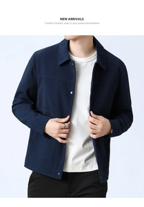 Detail of navy blue waffle texture fabric on men's lapel jacket with metal buttons