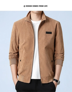 Detail of men's brown corduroy jacket featuring stand collar and ribbed cuffs
