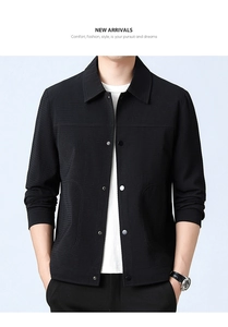 Detail of black waffle texture fabric on men's lapel jacket with button closure