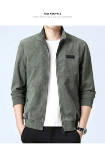 Detail of dark green corduroy jacket texture with ribbed cuffs and stand collar