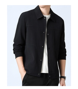 Detail shot of men's black waffle textured casual jacket with silver snap buttons