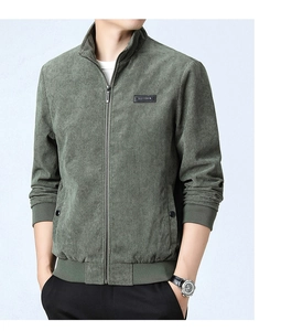 Close-up of olive green corduroy jacket with ribbed cuffs and metallic zipper