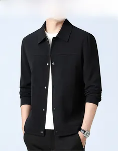 Detail of waffle textured black men's jacket showing matte snap buttons and collar