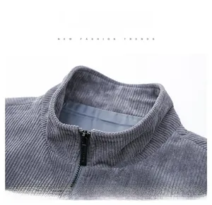 Detail view of grey corduroy jacket neckline and high-quality metallic zipper closure