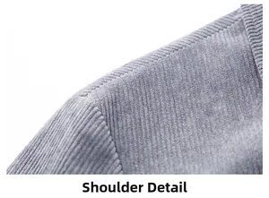 Detailed macro view of the grey corduroy fabric texture and stitching on the shoulder seam