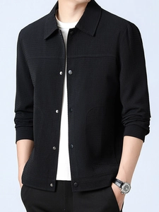Men's black waffle knit jacket with snap buttons and lapel collar in loose casual style
