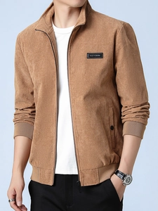 Men's casual brown corduroy jacket with stand collar and zipper closure on a male model