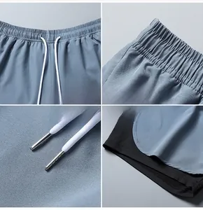 Detail of 2-in-1 shorts with elastic waist, metal-tipped drawstrings, and layered hem