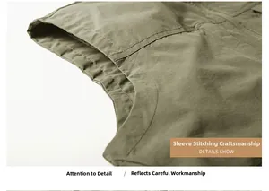 Détail de la double couture de l'emmanchure sur ce gilet de pêche extérieur vert olive