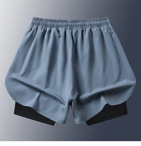 Detail of grey 2-in-1 sports shorts with elastic waistband and black inner lining