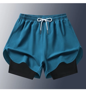 Detail view of double-layer sports shorts with quick-dry fabric and side slits