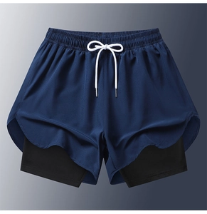 Detail of dark blue 2-in-1 men's running shorts with compression liner and drawstring