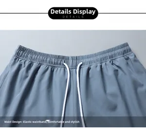 Detail of elastic waistband with white drawstring on men's quick-dry sports shorts