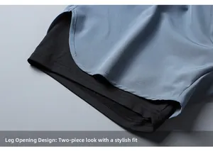Detailed macro view of dual-layer hem design on light blue 2-in-1 sports shorts