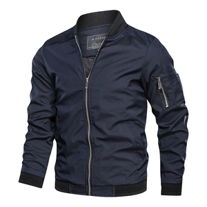 Detail of navy bomber jacket featuring a utility sleeve pocket and ribbed knit trims