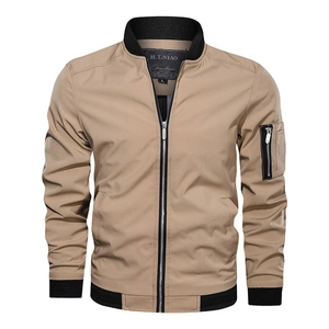 Detail of khaki bomber jacket featuring black ribbed collar and metallic front zipper