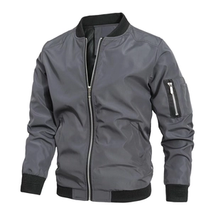 Close-up of MA-1 bomber jacket sleeve with functional zipper pocket and ribbed cuff