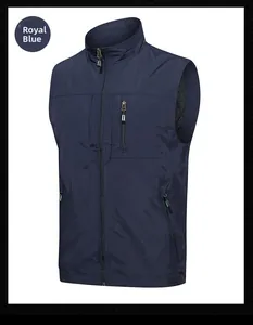 Detailed view of royal blue outdoor vest featuring a zipper chest pocket and stand collar