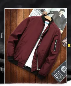 Detail of burgundy bomber jacket with rib-knit trims and metal sleeve pocket zipper
