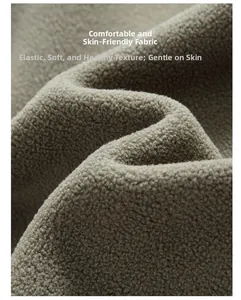 Macro shot of soft grey fleece fabric detail showing thick texture and warm fibers