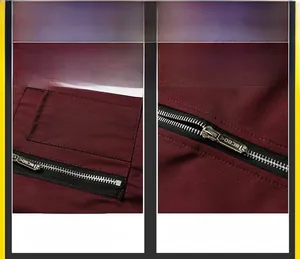 Close-up of metal zipper and pocket detail on burgundy slim-fit flight jacket