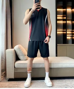 Close-up of black breathable sport vest and shorts with red gradient stripes and logos
