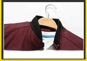 Detail view of the ribbed knit collar and sleek burgundy fabric of the bomber jacket