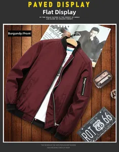 Flat lay of a burgundy men's bomber jacket with black ribbed collar and sleeve pocket
