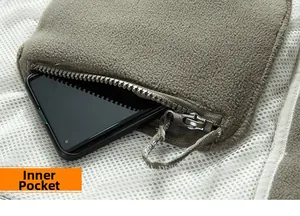 Detail of fleece jacket inner pocket with mesh lining and a smartphone inside