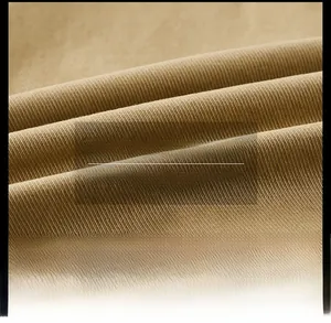 Macro view of khaki twill fabric texture showing premium washed finish and breathable weave
