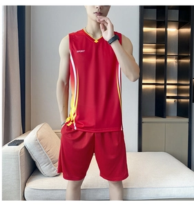 Detail of red men's sports set showing breathable mesh fabric and printed SPORT logo
